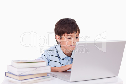 Boy working with a laptop