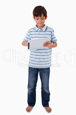 Portrait of a smiling boy using a tablet computer