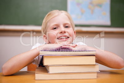 Girl leaning on books