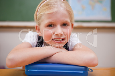 Girl leaning on her desk