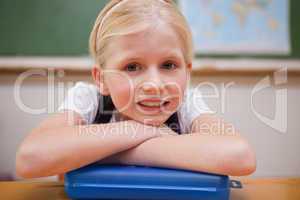 Girl leaning on her desk