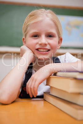 Portrait of a girl leaning on books