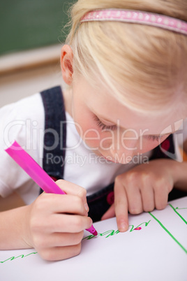 Portrait of a focused girl drawing