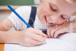 Close up of a schoolgirl writing something
