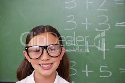 Smiling smart schoolgirl posing