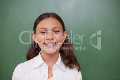 Happy schoolgirl posing