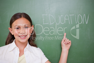 Schoolgirl pointing at a word
