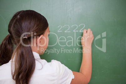Girl writing numbers