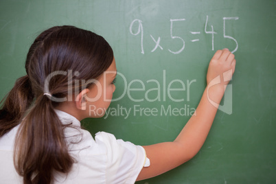 Schoolgirl writing a result