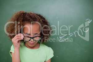 Schoolgirl looking above her glasses
