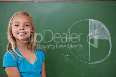 Smiling schoolgirl learning the divisions