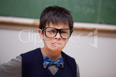 Grumpy schoolboy posing