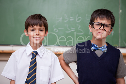 Schoolboys posing in front of a chalkboard