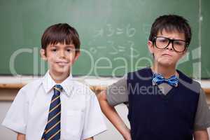 Schoolboys posing in front of a chalkboard