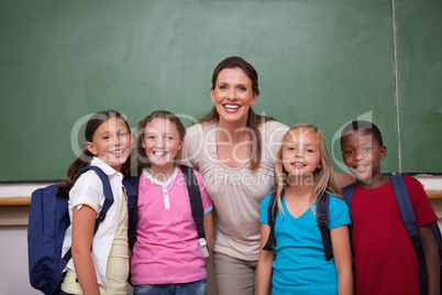 Schoolteacher posing with her pupils