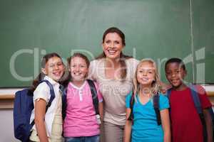 Schoolteacher posing with her pupils