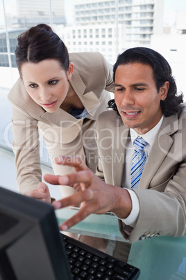 Portrait of a business team using a monitor