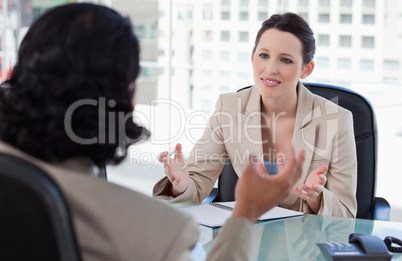 Smiling manager interviewing a male applicant