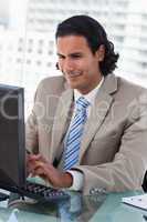 Portrait of a businessman working with a monitor