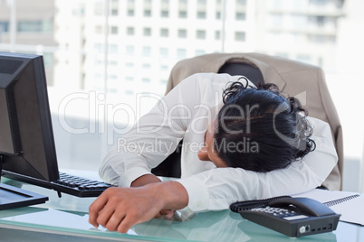 Businessman sleeping on his desk