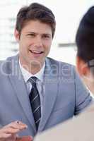 Portrait of a smiling manager interviewing a female applicant