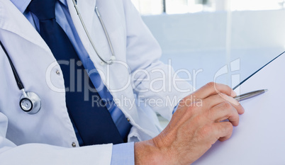 Close up of a doctor showing a document