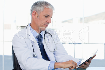 Doctor working with a tablet computer