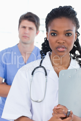 Portrait of serious doctors standing up