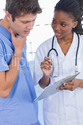 Portrait of doctors looking at a document