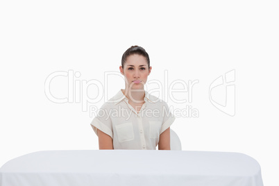 Businesswoman sitting behind a table