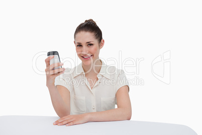 Smiling businesswoman reading a text message