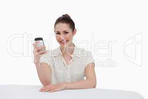 Smiling businesswoman reading a text message