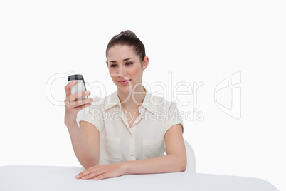 Businesswoman reading a text message