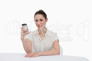 Businesswoman reading a text message