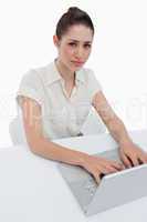 Portrait of a young businesswoman using a notebook