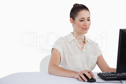 Young businesswoman using a monitor