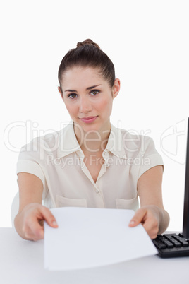 Portrait of a businesswoman giving a document