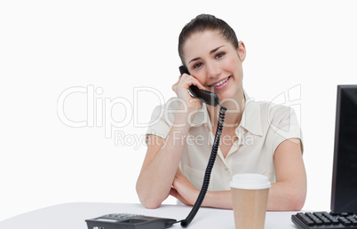 Smiling secretary answering the phone