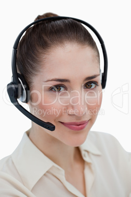 Portrait of a smiling operator posing with a headset