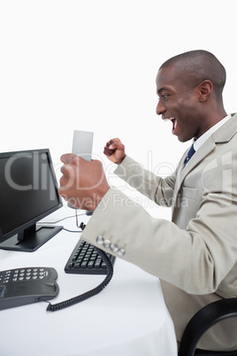 Portrait of a cheerful businessman using a computer