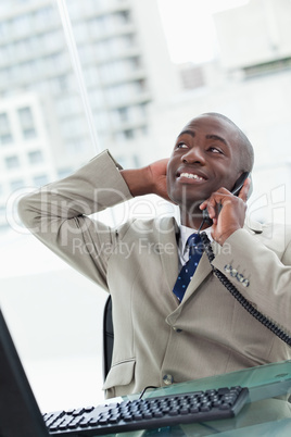 Portrait of a relaxed office worker on the phone