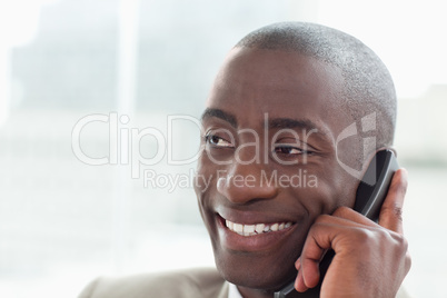 Close up of a happy businessman on the phone