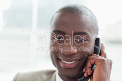 Close up of a smiling businessman on the phone