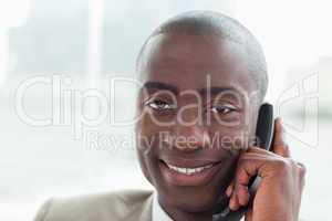 Close up of a smiling businessman on the phone