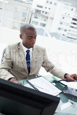 Portrait of a businessman hanging up