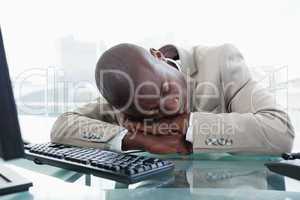 Businessman sleeping on his desk