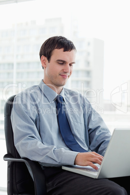 Portrait of a manager using a laptop