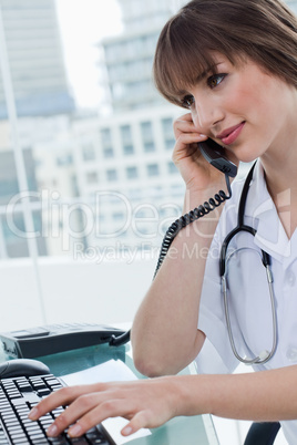 Portrait of a beautiful doctor on the phone