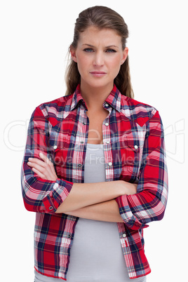 Portrait of a serious woman with the arms crossed