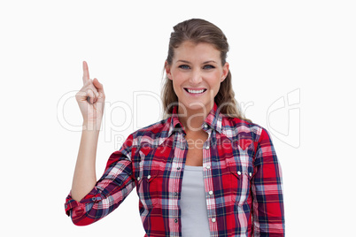 Woman pointing at a copy space
